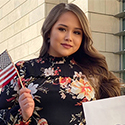 photo of woman holding an American flag