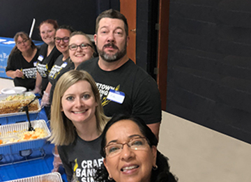 High Plains Bank team serving a meal