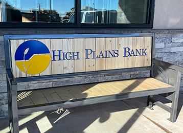 bench with the words High Plains Bank and logo