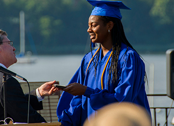 student receiving a diploma
