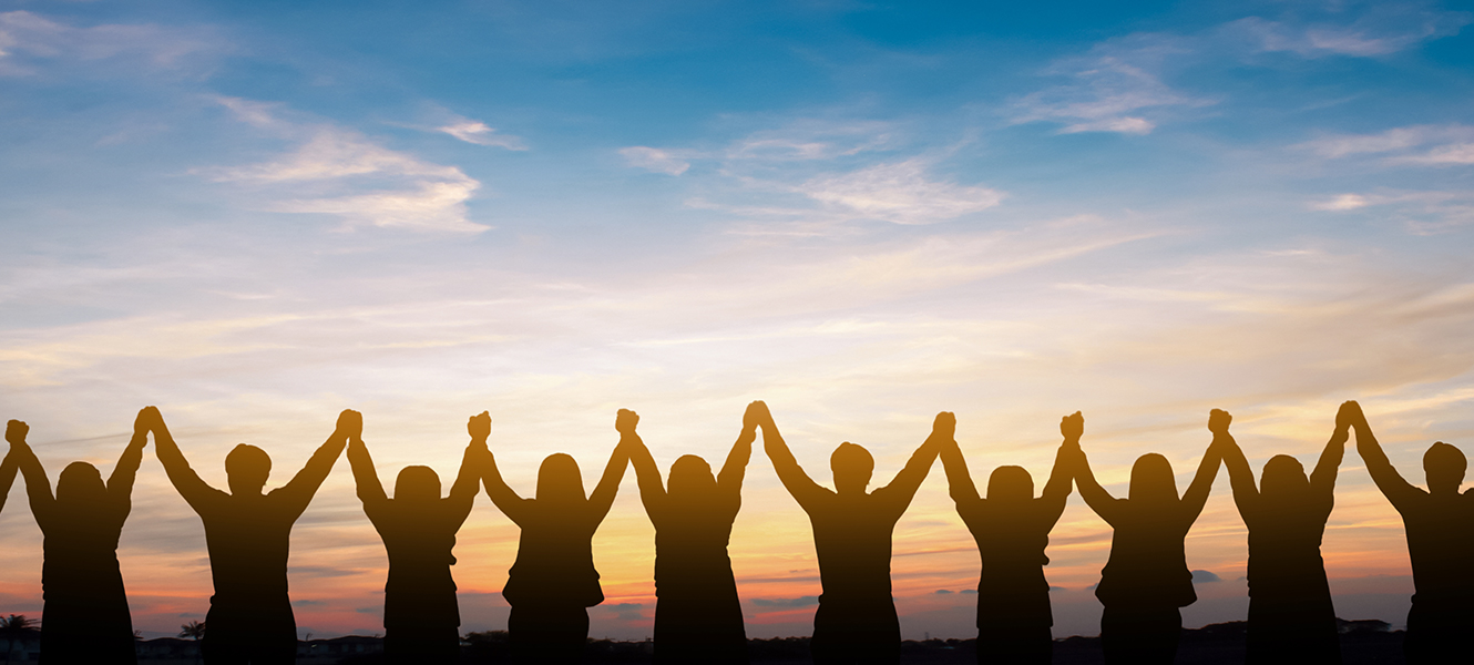 many people holding hands demonstrating community