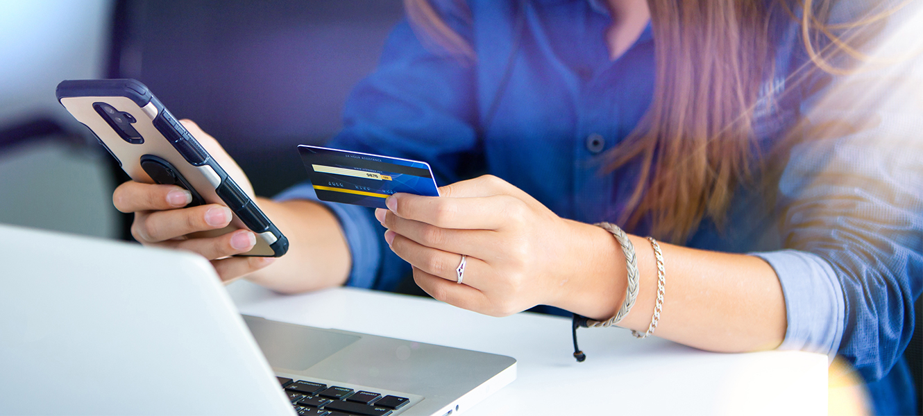 woman paying with credit card on her mobile phone