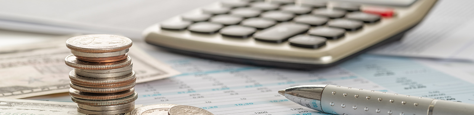 photo of calculator, pen, money