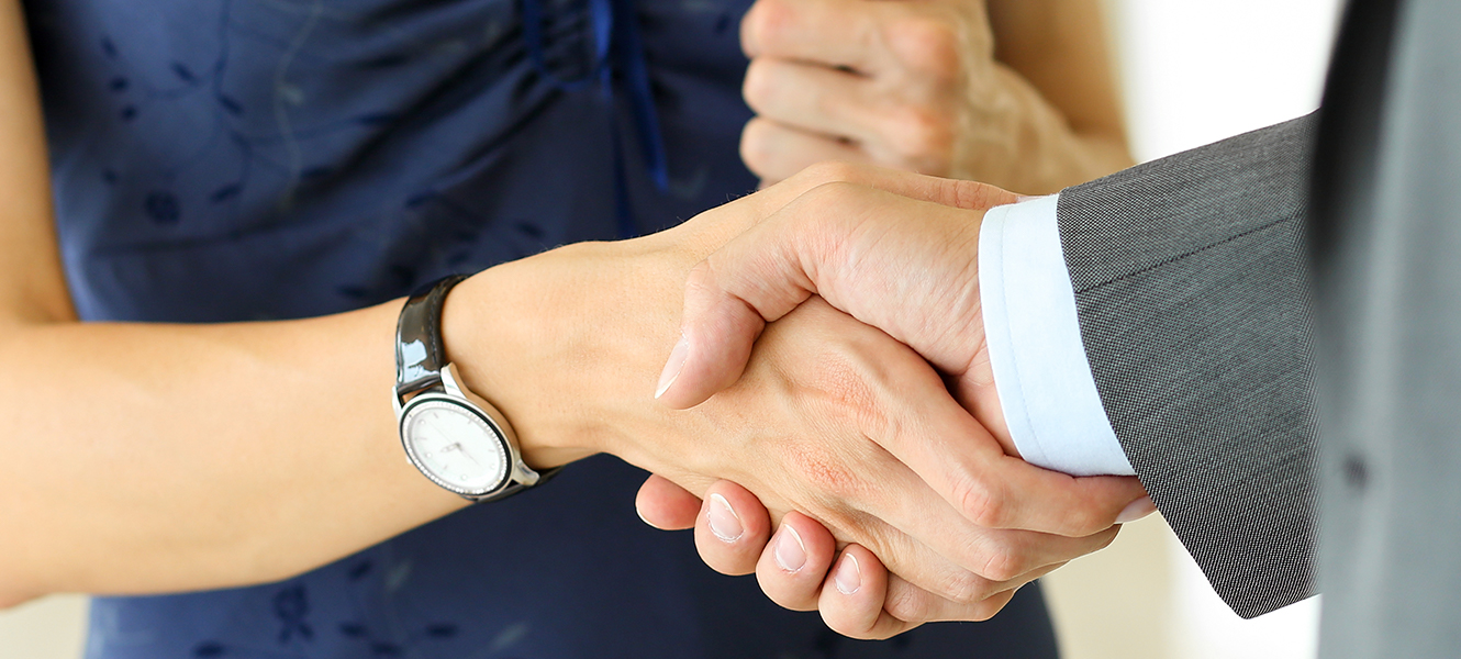 man and woman shaking hands