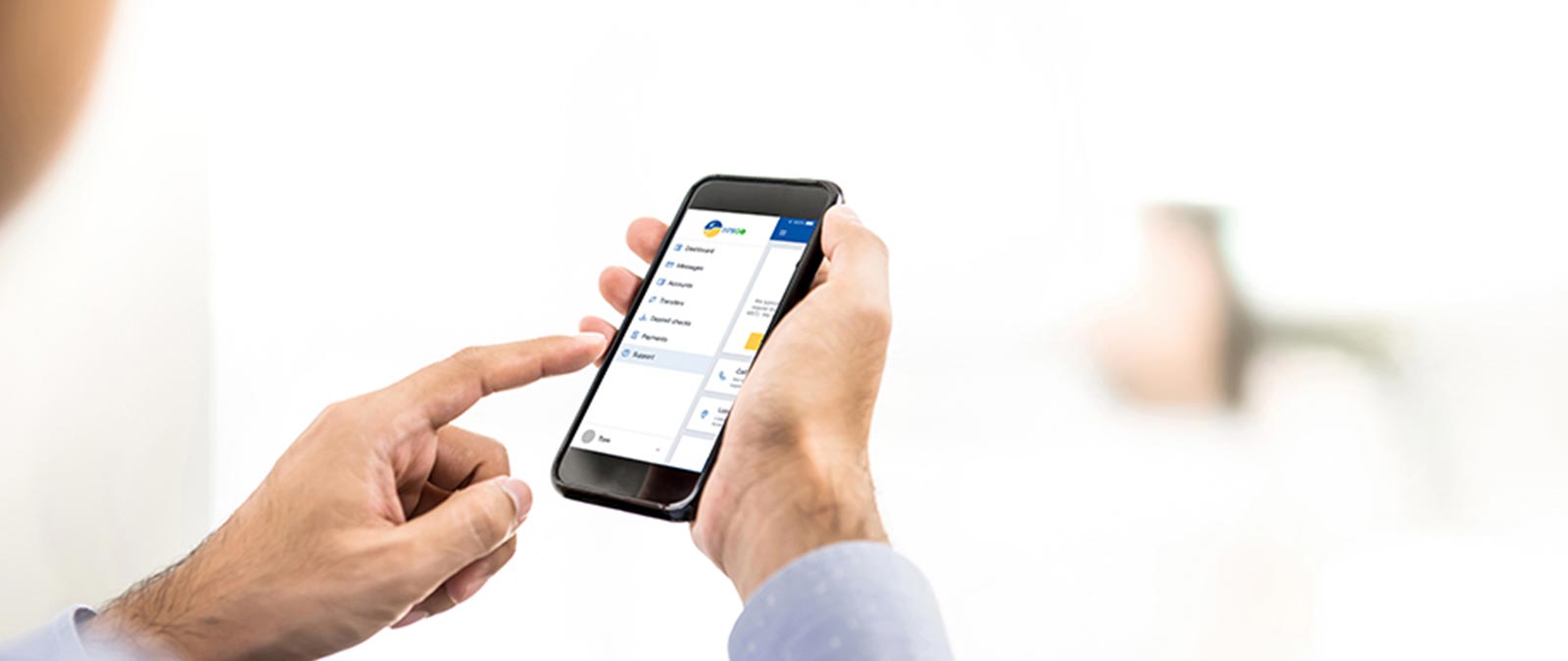 Photo of hand holding phone and phone pointing at phone