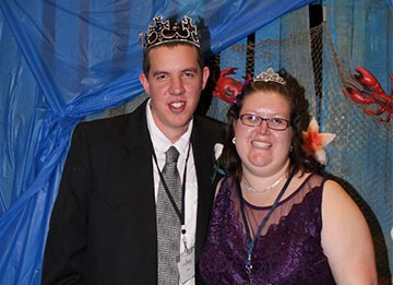 photo of two people at a prom wearing crowns